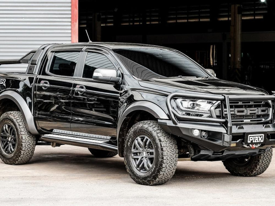 Side profile of the Ford Ranger Raptor PX MKIII featuring the PIAK Elite 3-Loop Bull Bar, highlighting its sleek multi-fold wing design and robust protection