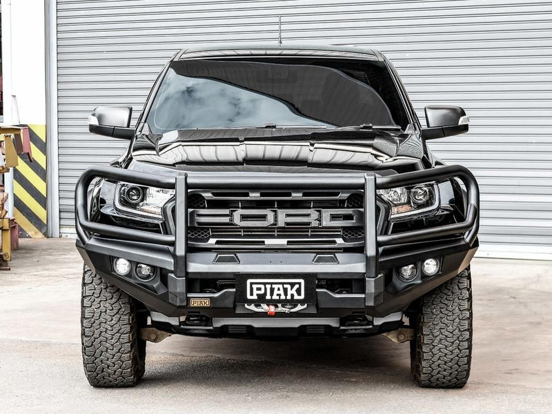 Front view of the Ford Ranger Raptor PX MKIII with the PIAK Elite 3-Loop Bull Bar, showcasing its black recovery points and bash plate for off-road protection