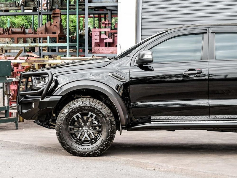 Side angle of the Ford Ranger Raptor PX MKIII with the PIAK Elite 3-Loop Bull Bar installed, showcasing its matte black powder coat finish and built-in recovery points