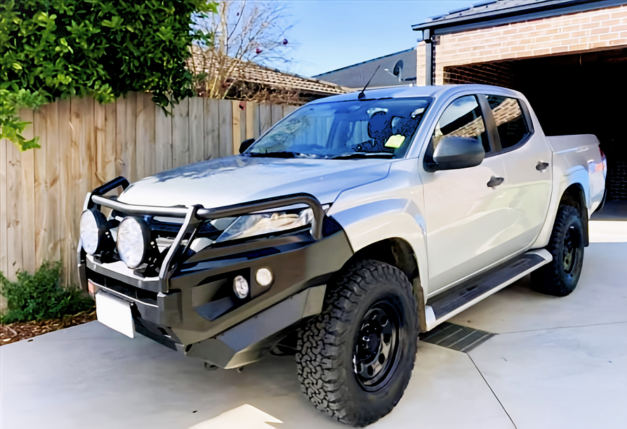 Side view of the PIAK Elite 3-Loop Winch Bull Bar for Mitsubishi Triton, highlighting the robust construction and black bash plate.